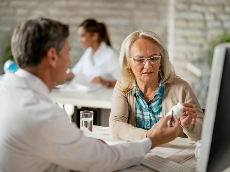 senior-woman-consulting-with-healthcare-worker-about-her-prescription-medicines-.jpg